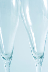 Two wine glass isolated over a blue background