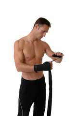 A boxer wrapping tape around his hands