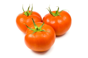 Three full tomatoes isolated on white background