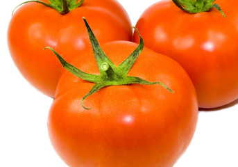 Three tomatoes isolated on white background