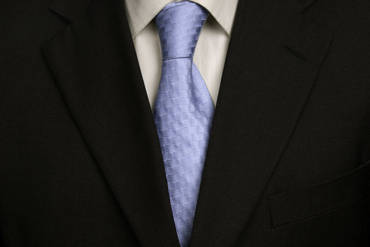 Detail Of A Business Man Suit With Blue Tie