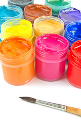 Multicolored gouache paints and paintbrush