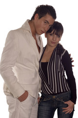 Young man and woman posing on white