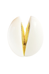 Hard boiled egg sliced in half, isolated on white background