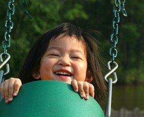 little girl on swing