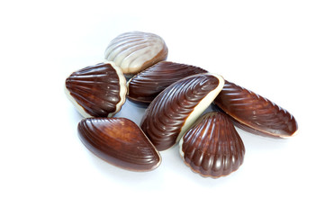 Heap of chocolate candies isolated on white