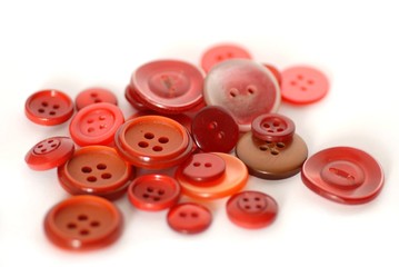 colored sewing buttons on a white background