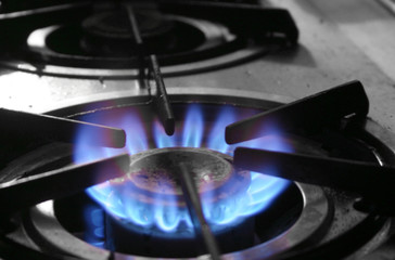 The blue flames of a gas powered stove top 