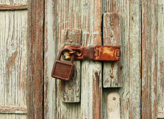Lock on old woden door.