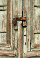 Lock on old woden door.