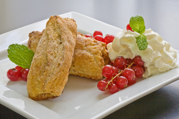 apple filled puff pastry with cream and berries