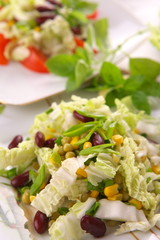 Fresh salad with corn and basil