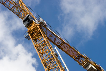 Yellow crane on a blue sky