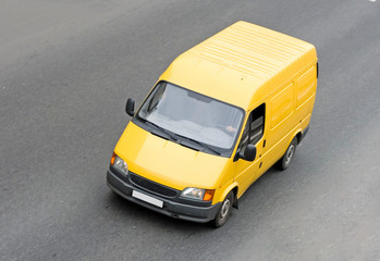 yellow blank pick-up van truck on road isolated
