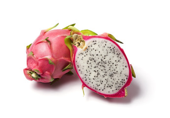 whole and half dragon fruit isolated on white background