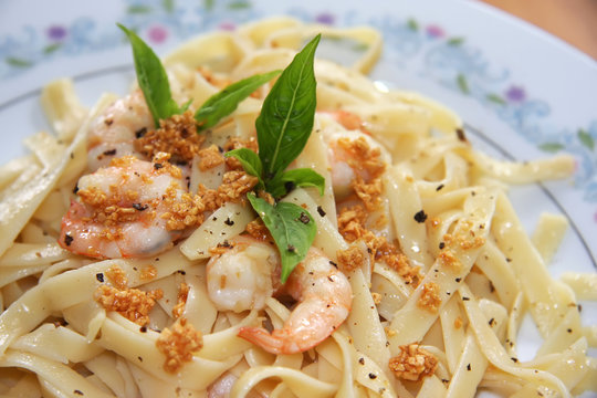 Pasta ala oglio with shrimp Italian cuisine