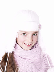 Closeup of girl, wearing wool winter hat and scarf