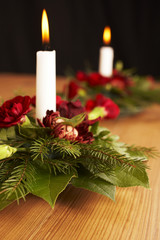 Candles with flower setup on the brown table