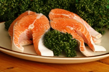 Salmon fillets  on the plate and parsley