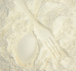 Imprint on the flour- spoon and fork