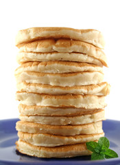 Stack of freshly cooked pancakes ready to serve.