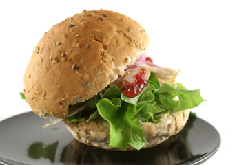 Turkey and lettuce and cranberry sauce on a wholemeal roll.
