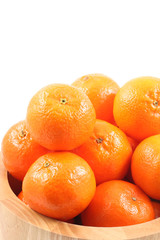 bowl of fresh tangerines isolated on white