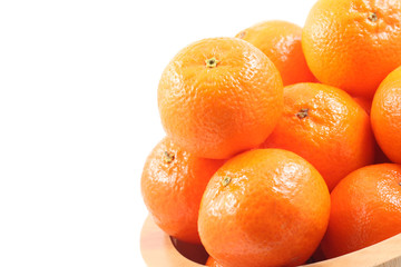 bowl of fresh tangerines isolated on white