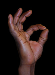 Hand Sign for OK, isolated on black background