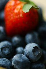 Blueberries and a strawberry