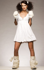 beautiful brunette winter girl wearing furry gloves 