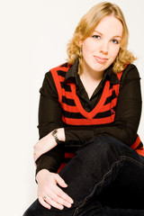 Fototapeta premium Portrait of a blond curly woman making eye contact