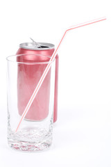 red soda can and empty glass