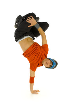 Young bboy standing on one hand. Holding legs in air. 