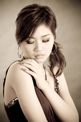 Obraz premium sentimental, sad looking young lady in warm tone colour