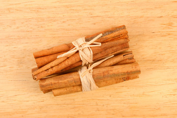 Cinnamon sticks on wood