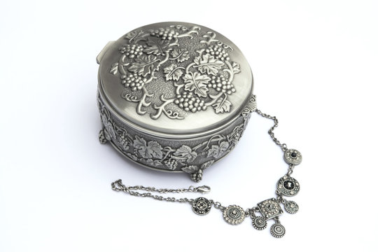 Silver Jewelry Box With A Neckless Isolated On White Background