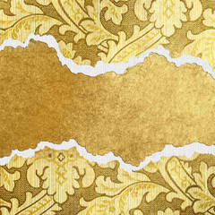 golden background from torn cardboard