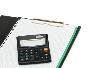 Calculator over binder isolated on the white
