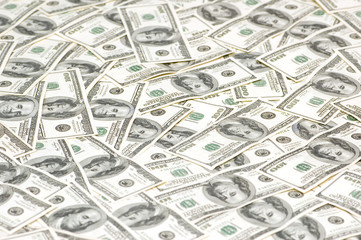 Lots of dollars arranged at the background