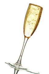 over flowing glass of champagne with lots of bubbles