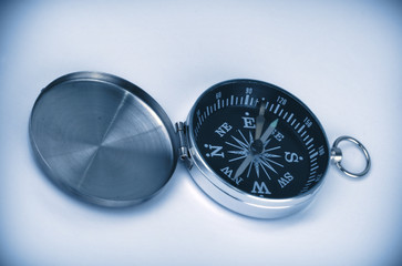 close-up of open compass in blue tones