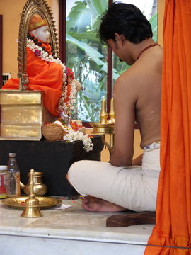 Hindu Priest Conducting A Puja In An Indian Temple