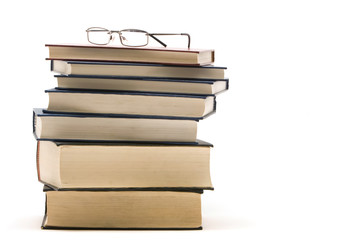 Eyeglasses on a stack of books