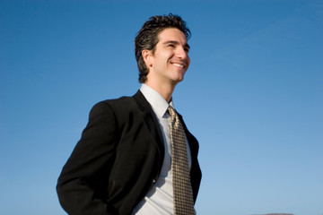 Smiling businessman in dark suit
