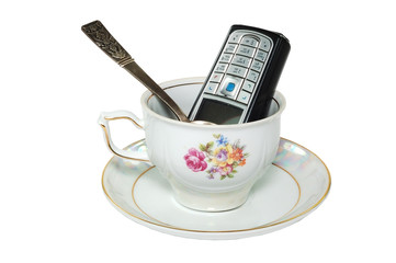 Mobile telephone in a cup..