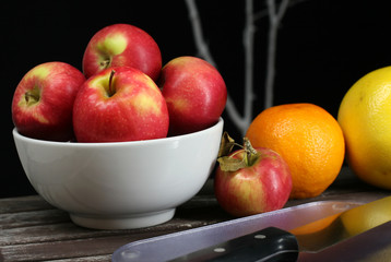 Apples, oranges, grapefruits, healthy fruit on a picnic table