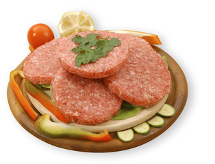 four raw hamburgers, isolated, with clipping path