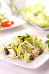 Fresh salad with corn and basil