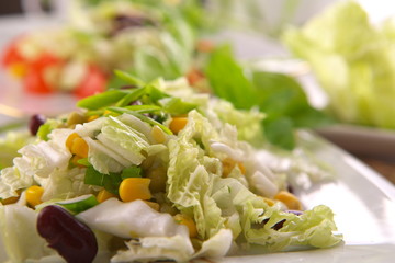 Fresh salad with corn and basil